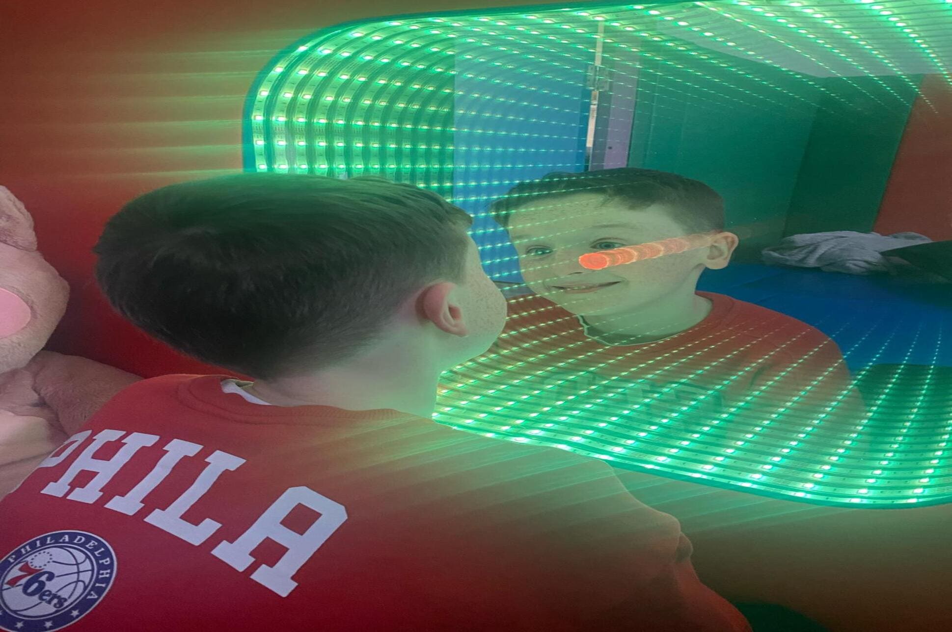 sensory room mirror Boy looking into mirror in Sensory Room